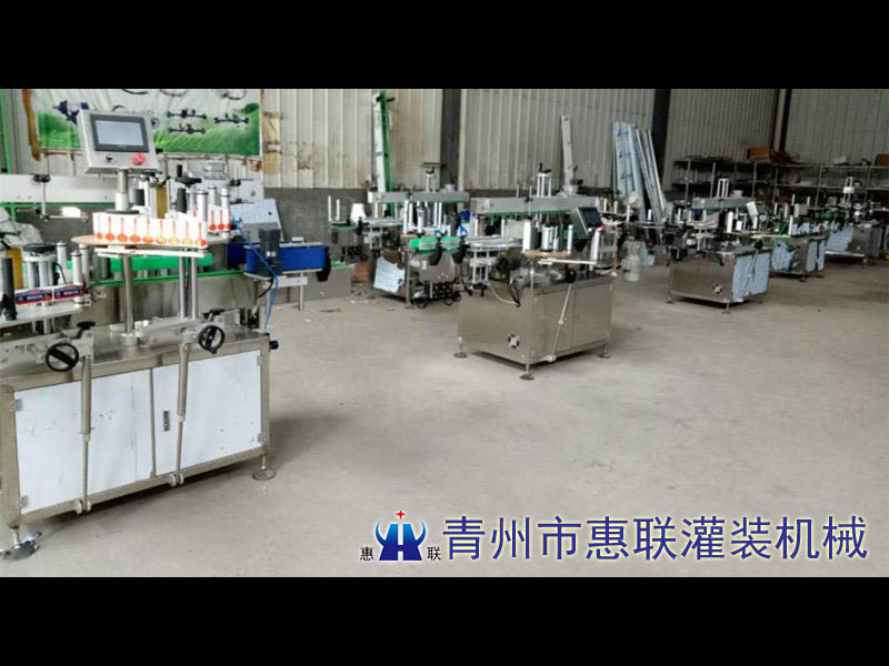 塑料桶貼標(biāo)機(jī)